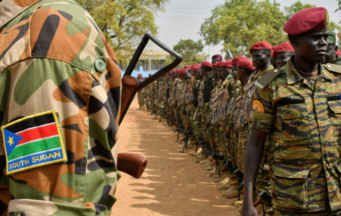 South Sudanese soldiers stand in line on the streets of Juba