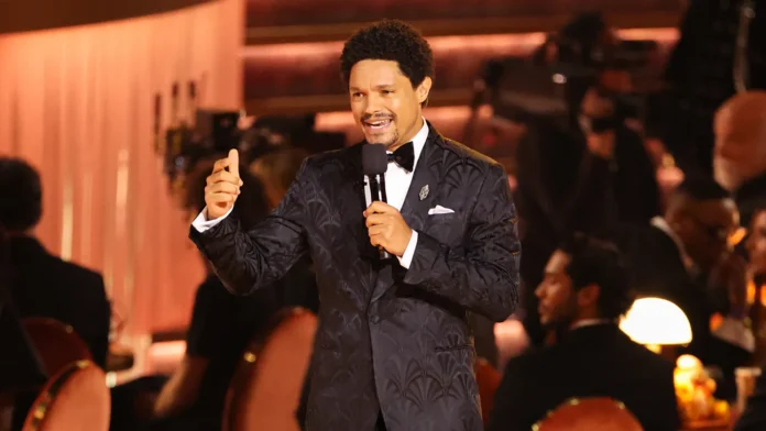 South African comedian Trevor Noah presenting on stage at the Grammy Awards ceremony South African comedian Trevor Noah presenting on stage at the Grammy Awards ceremony