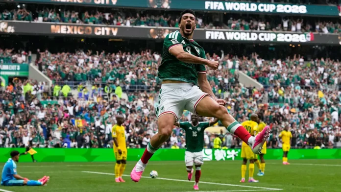 Mexico striker Raúl Jiménez celebrates after scoring against South Africa during the FIFA World Cup opening match at Estadio Azteca. Mexico striker Raúl Jiménez celebrates after scoring against South Africa during the FIFA World Cup opening match at Estadio Azteca.