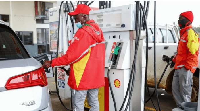 Motorists refuel vehicles as South Africa announces major fuel price cuts from July 2026