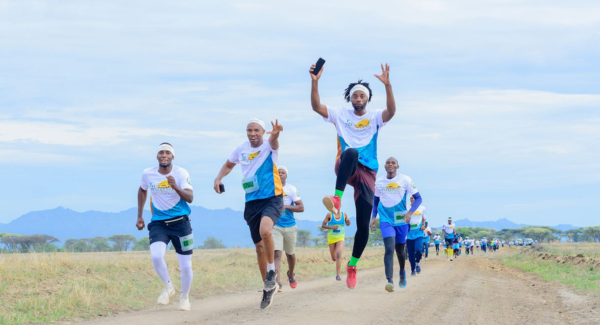 Serengeti Safari Marathon runners cross the landscape of Serengeti National Park as Tanzania promotes sports and experiential tourism. Serengeti Safari Marathon runners cross the landscape of Serengeti National Park as Tanzania promotes sports and experiential tourism.