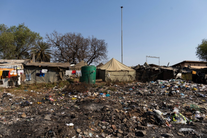 People live in squalid conditions in and around the main building at Wembley Stadium. People live in squalid conditions in and around the main building at Wembley Stadium.